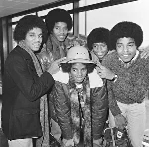 Images Dated 4th February 1979: Members of The Jackson Five pop group make their way through the arrivals hall as they