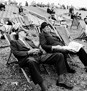 Two men asleep in deckchairs on the beach. August 1964 Two men asleep in deckchairs on the beach. August 1964