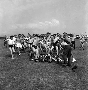 Men play hunt the shoes at a holiday camp Holiday scenes. August 1952 C4025 Men play hunt the shoes at a holiday camp Holiday scenes. August 1952 C4025