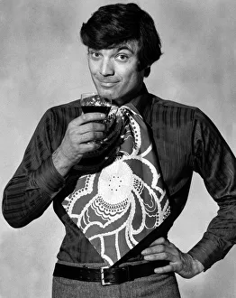 Mens Fashion Bib Tie Man modelling bib tie drinking a glass of wine Mens Fashion Bib Tie Man modelling bib tie drinking a glass of wine