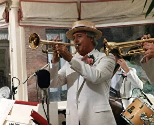 Michael Aspel TV Presenter playing the trumpet Michael Aspel TV Presenter playing the trumpet