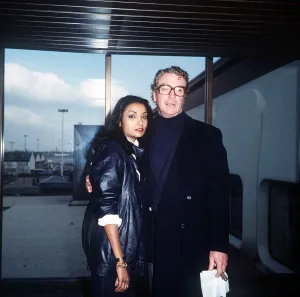 Images Dated 12th February 1984: Michael Caine Actor with wife Shakira at LAP Febraury 1984