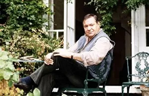 Images Dated 18th August 1996: Michael Elphick Actor sitting in chair at home in garden