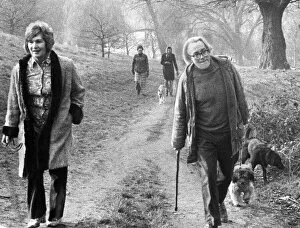 Images Dated 1st March 1974: Michael Foot and wife Jill Craigie walking their dogs on Hampstead Heath - March 1974