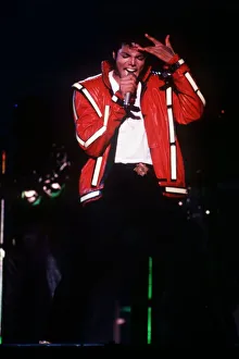 Michael Jackson concert Tokyo Japan red jacket hand on head singing microphone 1987 Michael Jackson concert Tokyo Japan red jacket hand on head singing microphone 1987