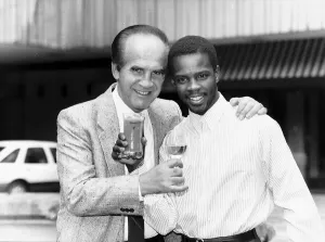 Images Dated 6th March 1989: Mickey Duff Boxing Manager and Promoter drinks a toast with one of his Boxers Duke