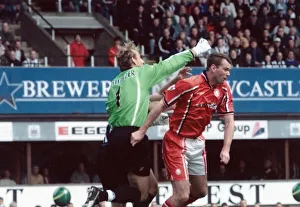 Middlesbrough keeper Mark Schwarzer knocks out team mate Gary Pallister while clearing a Middlesbrough keeper Mark Schwarzer knocks out team mate Gary Pallister while clearing a
