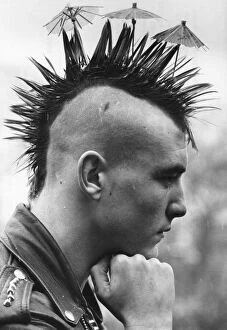 Images Dated 4th March 1981: Mike the spike Lang with his Mohican haircut complete with tiny cocktail umbrellas