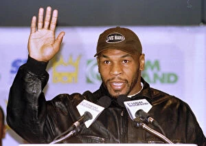 Images Dated 13th March 1996: Mike Tyson waves during the head to head press Conference for the Heavyweight World Title