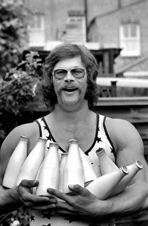 Images Dated 14th July 1974: Mike Winch (athelete shot-putter) puts his success down to drinking milk