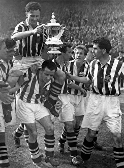 Millard, the West Brom Captain holding the FA Cup is chaired by his colleagues round Millard, the West Brom Captain holding the FA Cup is chaired by his colleagues round