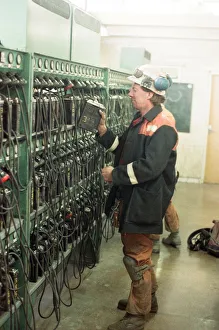 A miner returns his lamp to the lamp room for the final time as the last shift at A miner returns his lamp to the lamp room for the final time as the last shift at