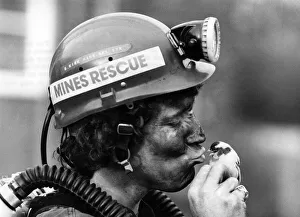 A Mines rescue worker kissing his canary. January 1981 P017743 A Mines rescue worker kissing his canary. January 1981 P017743