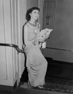 00002 Prints: A 1952 photograph print of a young woman at a film premiere