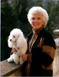 Katie Boyle Print - Columnist on Bridge with Dog