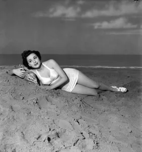 Retro Swimwear Designs Prints: Film star Lara Morris in new bathing costume made of white satiri and elastic