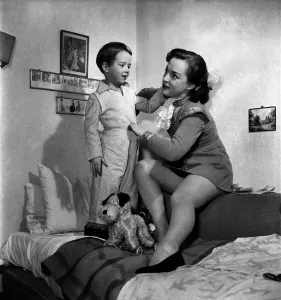 00019 Prints: Print of a mother gently placing her child in bed