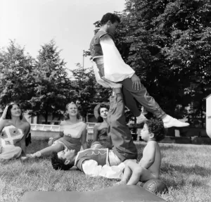 00024 Prints: 1953 Print of Toddler Watching Acrobats Rehearse on Ice