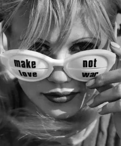 Fashion In The 60s Prints: Sun glasses feature - worn by model Nikki have writing on them saying