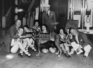 00029 Prints: The Crazy Gang members with showgirls and a greyhound, print