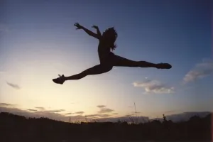 00030 Prints: A ballet dancer in mid-air doing a split, Print