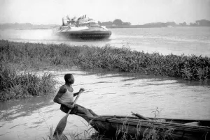 00032 Prints: Print of a man on his boat in the Zambesi river, December 1969