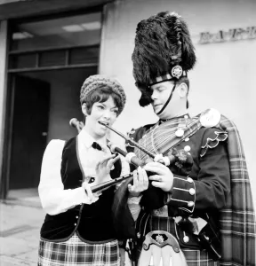 Black and white photograph print of Margaret Savage with a Scots Guardsman