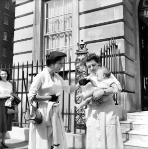 00035 Prints: Elizabeth Taylor Hands Over Baby to Nurse Print, 1953
