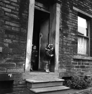 00035 Prints: A Little Girl Stands at the Front Door Print, November 1953