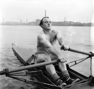 00036 Prints: Ron Fagan, a 27-year-old lighterman, rows on a London river