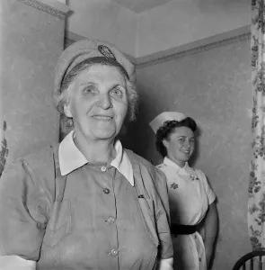 00037 Prints: Print of a nurse delivering a baby at the Stretham Clinic, August 1953