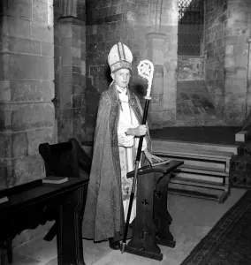 00037 Prints: Black and white photograph print of a young boy in a bishop's attire