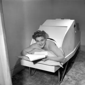 00040 Prints: Print of Actress Hy Hazel in a dry heat rheumatic bath