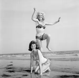 00040 Prints: Print of two women, Marion and Jean Collins, posing on a beach in 1960