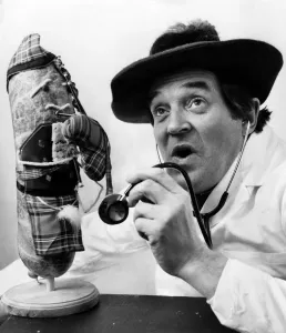 00041 Prints: Scots Comedian Doctor Jimmy Logan Inspects a Haggis in Print