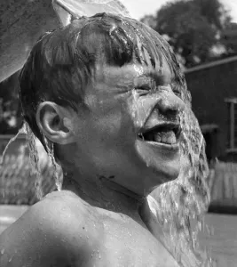 00044 Prints: A 13-year-old boy is submerged in water at the Brockwell Park lido, Print