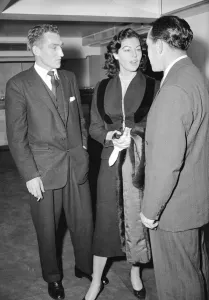 00046 Prints: Ava Gardner with Footballers Print, January 1955