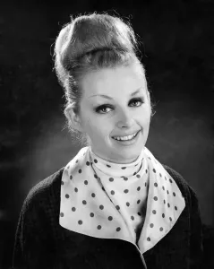 Fashionable Women's Coats Prints: Reveille Fashions 1964. Model wearing coat with polka dot collar with matching top