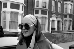 00055 Prints: Black and white print of a woman leaving her home