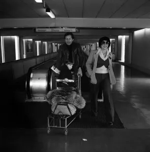 Joan Collins and Family Leaving Heathrow Airport Print 1975
