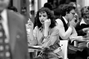 00060 Prints: Woman Smoking at a Parisian Cafe Print, April 1975 (00060)