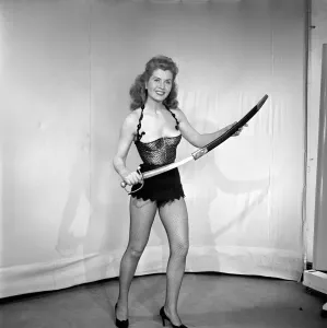 00062 Prints: 1959 Print of a Showgirl Holding a Sword