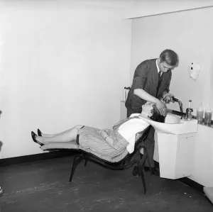00067 Prints: Woman having her hair washed in a 1960s print