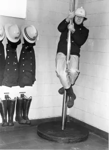 00072 Prints: Firefighter Geoff Kelly Slides Down the Pole Print