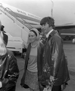 Entertainment In The 1960s Prints: John Lennon and girlfriend Cynthia at Heathrow Airport 26 May 1964