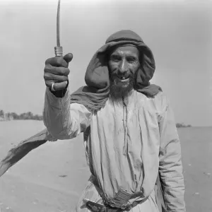 00085 Prints: Abu Dhabi Camel Herder Print, July 1965