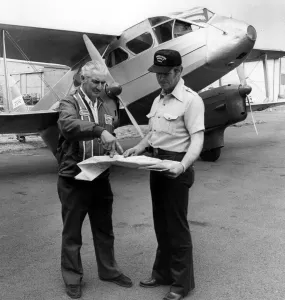 00093 Prints: Pilots Discuss Flight Plan to Canada, 1976 Print