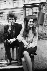 Prints of American folk singers Bob Dylan and Joan Baez pictured in the Savoy Gardens on the Thames embankment in London. 27th April 1965 London Prints: Bob Dylan and Joan Baez Print, Savoy Gardens London 1965