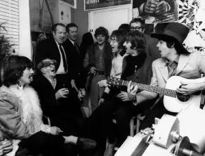 Prints of The Beatles in the Old Compton Street, Soho with street busker Bill Davis. Left is George Harrison with Paul McCartney strumming guitar (right) sitting next to Ringo Starr and John Lennon Pop Art Prints: The Beatles in Old Compton Street Print, November 1967