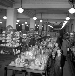 Kensington High Street History Prints: Ladies look at crockery and glasses for sale during the January sales in Kensington High